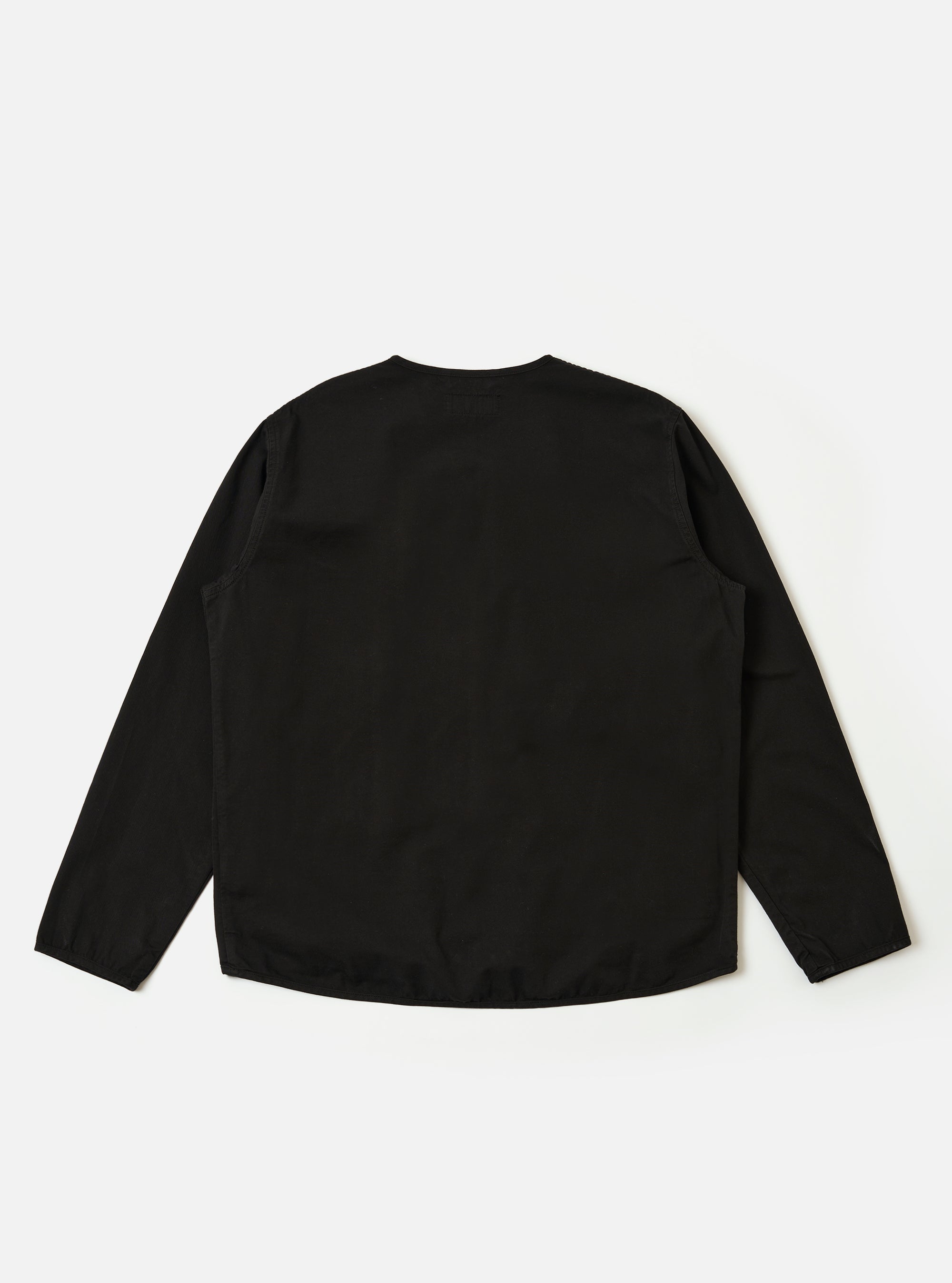 The Black Kelly Cotton Glider Jacket is shown as a flat lay against a white background. The jacket features a collarless neckline with bound edges, a full-length exposed front zipper, and four large expandable bellows pockets on the front. The cotton fabric has a smooth, compact twill finish.