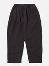 The Licorice Lyo Linen Mix Oxford Pant is shown as a flat lay against a plain white background. The trousers feature a loose, wide-leg fit, an elasticated waistband with a tonal drawstring, and two side pockets. The fabric is a dark brown, licorice-colored linen mix with a visible smooth texture.