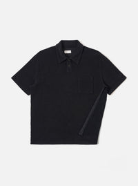 The Black Light Weight Terry Newlyn Polo is shown as a flat lay against a white background. The polo features a three-button placket, a classic collar, and short sleeves. The fabric has a soft, fine-looped terry texture in a solid black color.