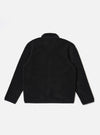The Black Alvar Fleece Lancaster Jacket is shown from the back as a flat lay against a plain white background. The image highlights the jacket's textured black fleece fabric, a curved hem, and a simple one-piece back panel.