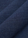 A close-up swatch image of the Navy Maiorca Jersey Cardigan fabric highlights a textured, woven pattern in a deep navy blue. The fabric has a distinct interlaced appearance with subtle variations in color.