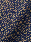 A close-up fabric swatch of the Navy Konos Cotton Judo Pant highlights the textured weave and deep navy blue color of the cotton material. The fabric fills the frame, providing a detailed view of the garment's construction and pattern.