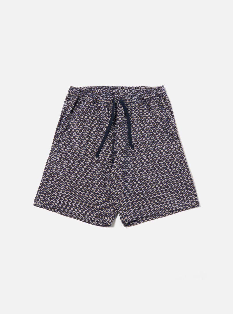 The Navy Konos Cotton Simple Short is shown as a flat lay against a plain white background. The shorts feature an elasticated waistband and side pockets. The navy blue cotton fabric has a visible tonal pattern throughout.