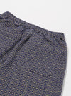 The Navy Konos Cotton Simple Short is shown from the back as a flat lay against a plain white background. The shorts feature an elasticated waistband and a single rear patch pocket. The navy cotton fabric highlights a patterned texture.