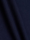 A swatch image showing a close-up detail of the Walsh x Universal Works Navy Single Jersey T Shirt fabric against a plain white backdrop. The shot highlights the fine knit pattern, soft texture, and solid navy blue colorway.