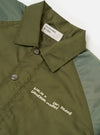 Front view of the Walsh x Universal Works Olive Flight Nylon Club Coach Jacket presented on a plain white studio background. The jacket features classic snap buttons, side welt pockets, a flat collar, and smooth olive green nylon fabric.