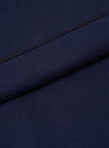 A macro fabric swatch shot of the Walsh x Universal Works Navy Brushback Sweat Panelled Loose Sweatshirt. The image highlights the rich dark navy color, soft cotton fleece weave texture, and high-quality knit finish in close detail.