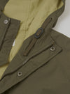 A detailed product shot of the Olive WR Recycled Nylon Peak Parka set against a plain light studio background. Prominent features highlight the durable nylon fabric texture, hood construction, and clean rear seam stitching.