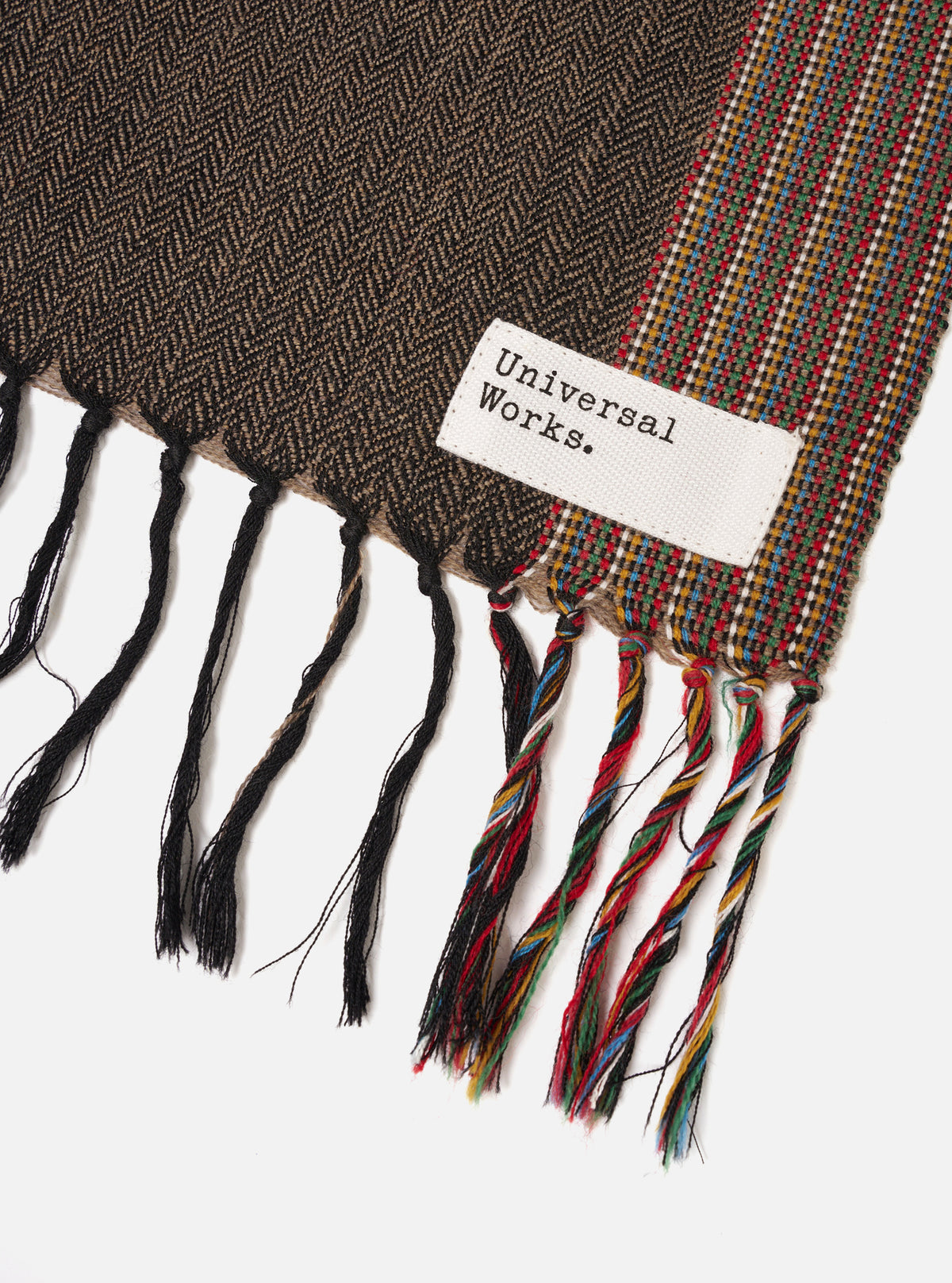 Alternate product view of the Multi Reversible Wool Himalayan Scarf set against a plain backdrop. The photo highlights the reversible multi-colored pattern, rich wool texture, and folded arrangement.