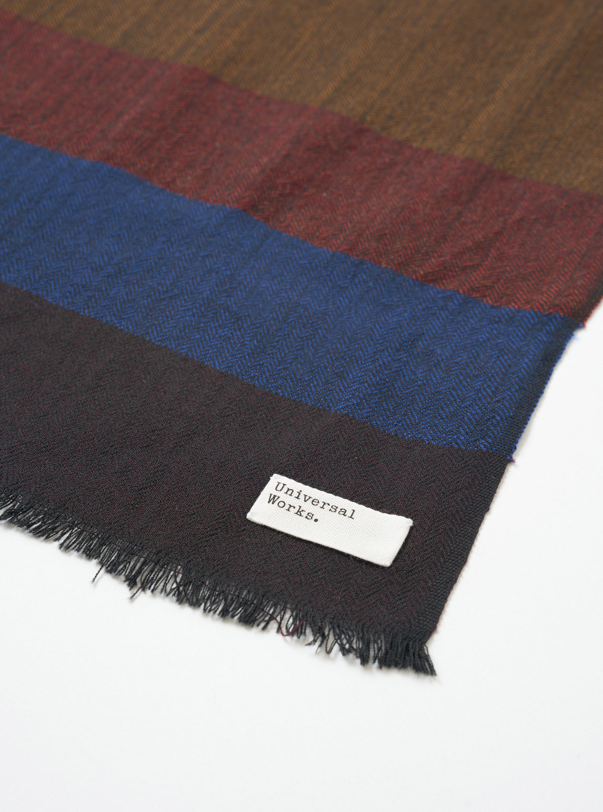 An alternate layout view of the Brown Reversible Wool Himalayan Scarf against a clean white backdrop. Prominent features include the woven texture, two-tone reversible finish, and delicate fringed edges at the border.