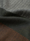 Detailed fabric swatch image highlighting the Grey Reversible Wool Himalayan Scarf against a plain background. The shot captures the soft grey and charcoal thread weave, subtle heathered finish, and fine texture.