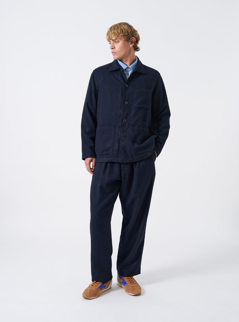 A model wearing the Navy Bob Wool Mix Bakers Overshirt, shown from the front. The navy blue overshirt features a buttoned front placket, classic collar, and multiple patch pockets against a plain neutral background.