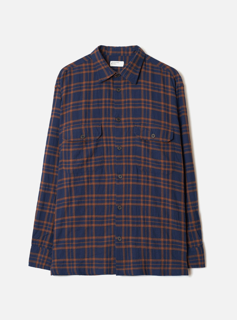 A studio product shot of the Navy/Brown Young Check CPO Shirt displayed on a white background. The front view highlights the checked cotton pattern, classic button placket, collar, and chest pockets.