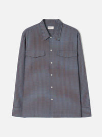 A product shot of the Universal Works Blue/Brown Parker Check Attendant Shirt laid flat against a plain background. The long-sleeve shirt features a blue and brown check pattern, flat collar, button front, and dual chest flap pockets.