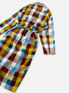 A product shot highlighting the rear view of the Universal Works Multi Check Evans Check Long Dressing Gown laid flat against a plain backdrop, displaying the full-length silhouette, multi-check pattern, and wrapped belt band.