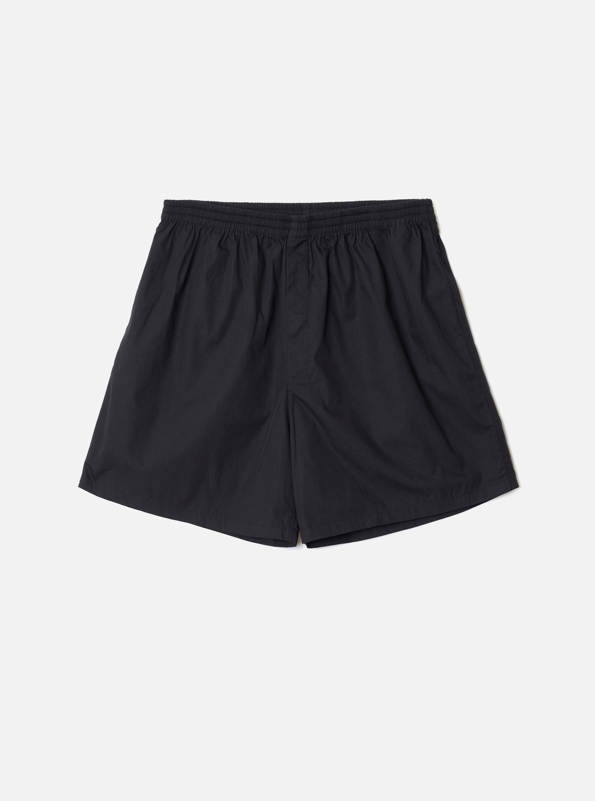 Front view of the Universal Works Black Broadcloth Boxer Shorts presented on a neutral background. Features plain black cotton broadcloth fabric, comfortable elasticated waistband, and classic casual cut.