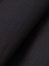 Close-up fabric swatch image of the Black Broadcloth Boxer Shorts by Universal Works. Displays the weave, soft texture, and solid dark shade of the black cotton broadcloth material against a neutral background.