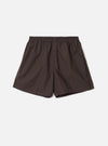 Front view of the Universal Works Brown Broadcloth Boxer Shorts shown on a plain backdrop. Features rich brown cotton broadcloth fabric, smooth elastic waistband, side stitching, and classic relaxed fit.