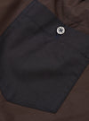 Close-up view of the Universal Works Mix Broadcloth Boxer Shorts set against a plain backdrop. Displays the contrasting cotton broadcloth panels, neat stitching details, and elastic waistband construction.