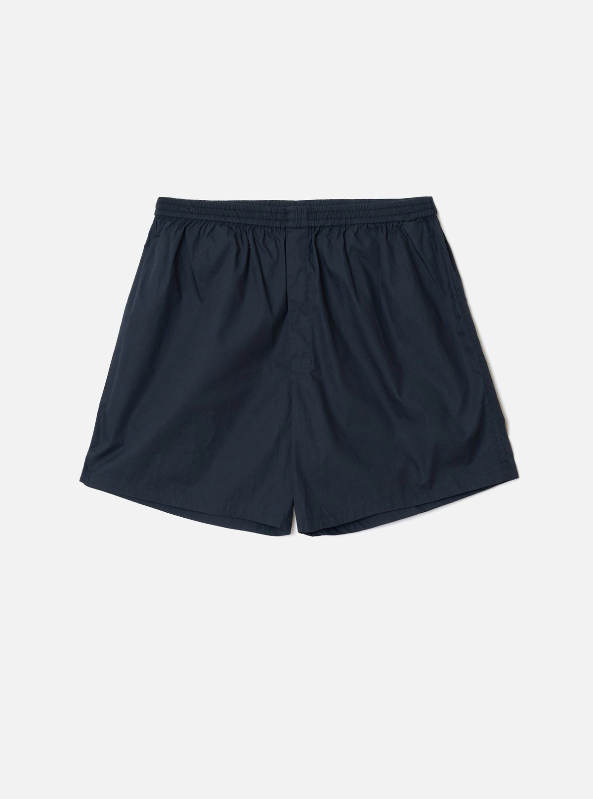 Front view of the Universal Works Navy Broadcloth Boxer Shorts shown on a plain backdrop. Features smooth navy blue cotton broadcloth fabric, comfortable elasticated waistband, and classic undergarment cut.