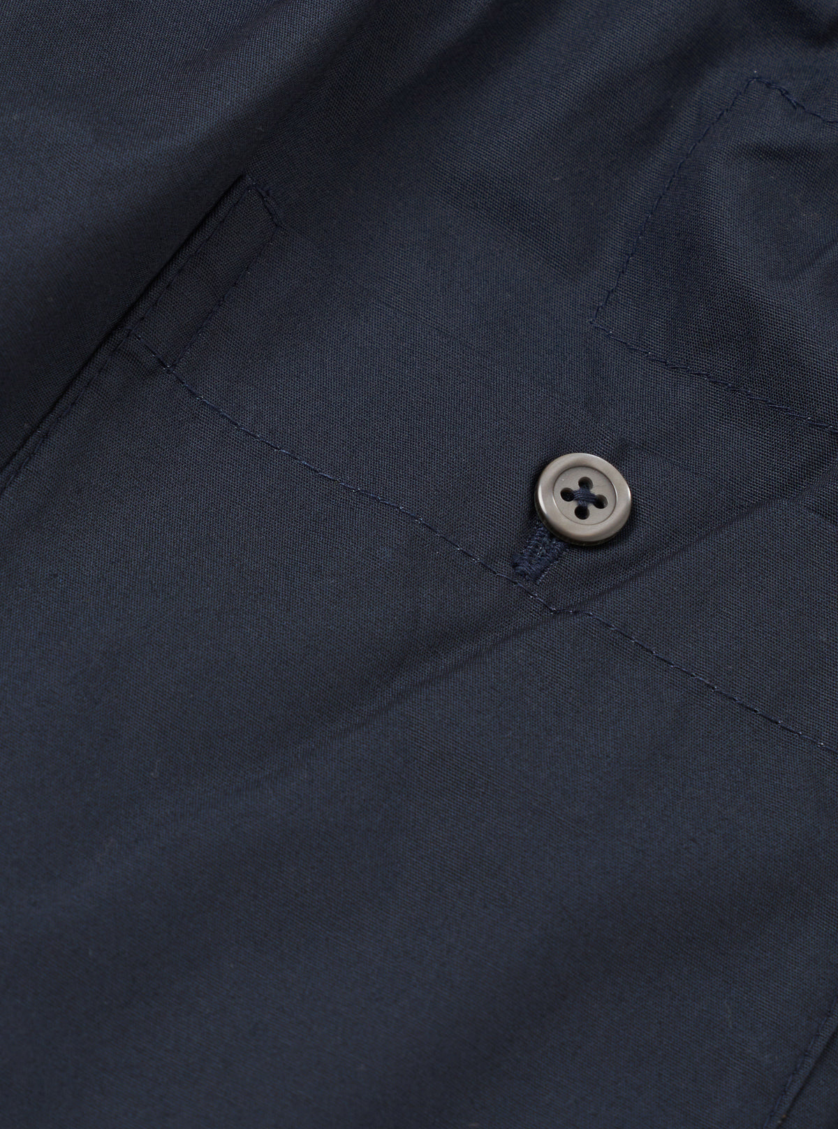 Back view of the Universal Works Navy Broadcloth Boxer Shorts displayed against a neutral background. Showcases the smooth navy blue cotton broadcloth material, flexible elastic waist, and clean stitch detail.