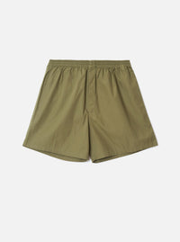 Front view of the Universal Works Olive Broadcloth Boxer Shorts laid flat against a plain white background. The olive green cotton shorts feature an elasticated waistband and relaxed fit.