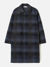 Front view of the Universal Works Navy/Brown Berlin Wool Check Account Coat on a plain background. The long winter coat features a navy and brown checkered pattern, point collar, and large flap patch pockets.