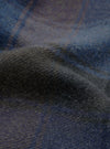 A close-up fabric swatch image of the Universal Works Navy/Brown Berlin Wool Check Account Coat, showcasing the rich textured weave of the navy, brown, and grey checkered wool blend fabric.