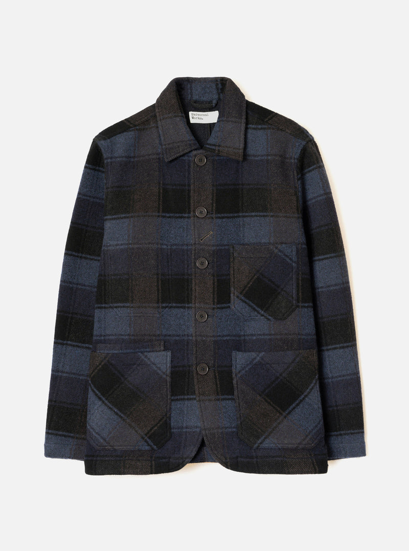 Front view of the Universal Works Navy/Brown Berlin Wool Check OG Bakers Chore Jacket against a plain backdrop. The jacket features a navy and brown check pattern, front button closure, and angled patch pockets.
