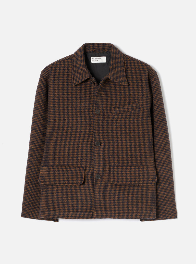 A studio front view of the Navy/Brown Wool Tweed Mix Franck Jacket set against a plain backdrop. The jacket features a flat collar, full front zip fastening, chest pocket, and lower patch pockets in textured dark navy and brown tweed.