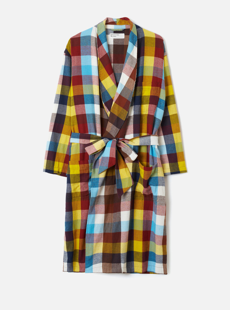 A studio front view of the Multi Check Evans Check Short Dressing Gown on a white background. The robe features a colorful check pattern, wide kimono-style sleeves, a lapel collar, two front patch pockets, and a matching waist tie.