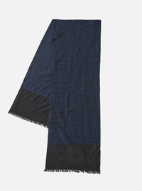A full view of the Universal Works Black/Blue Jacquard Silk Scarf laid out against a plain background. The rectangular silk scarf highlights its intricate black and blue woven pattern, smooth fabric texture, and finished edges.