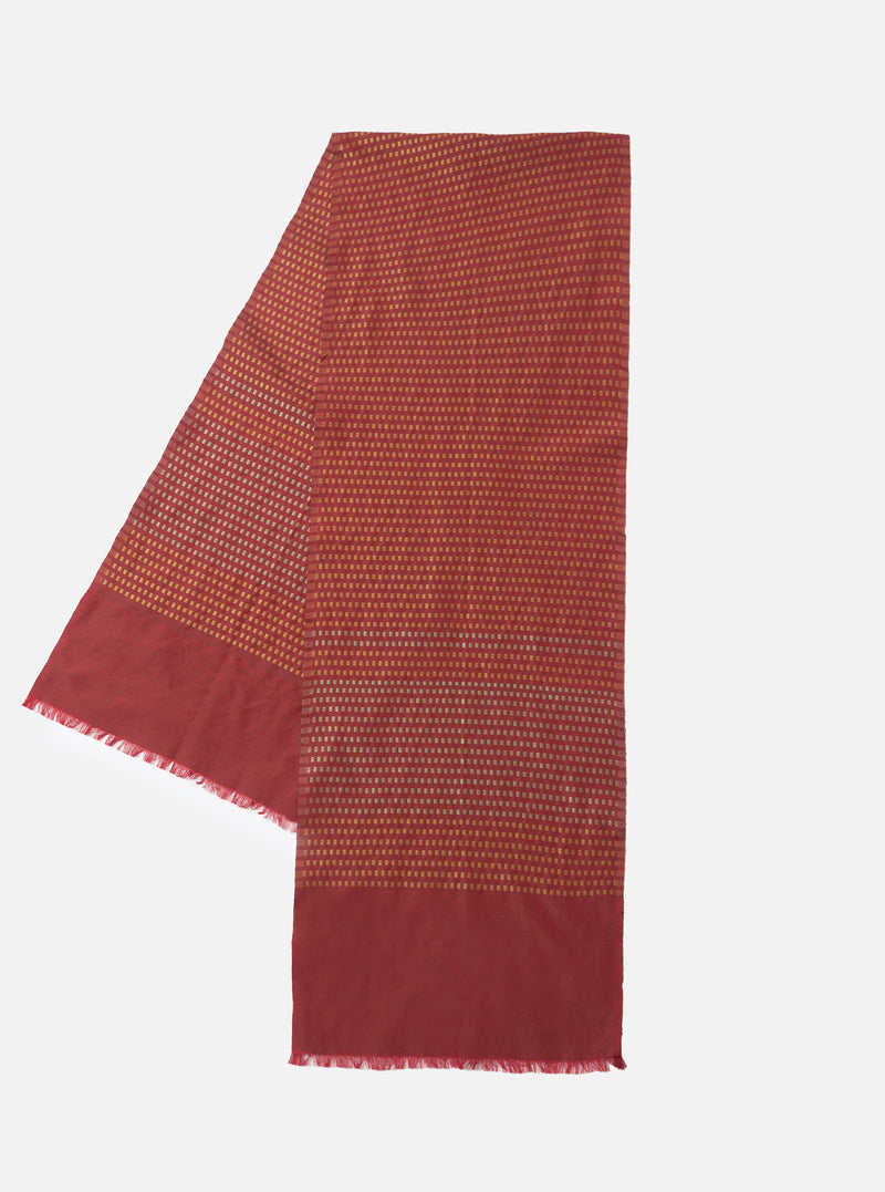 A full view of the Universal Works Red/Silver/Gold Jacquard Silk Scarf laid flat on a plain background. The scarf highlights a rich red base with silver and gold jacquard pattern detailing along the length of the silk fabric.