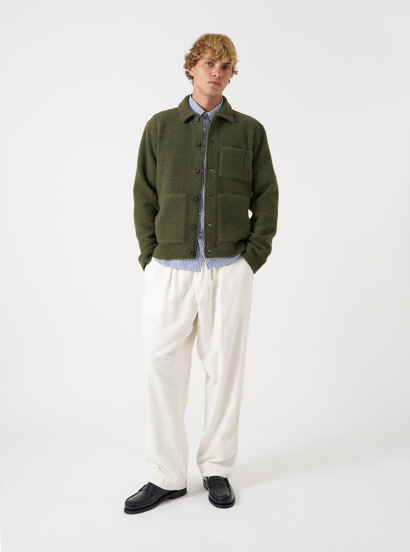 A front view of a model wearing the Ecru CPH Velvet Oxford Pant. The light off-white velvet trousers feature a loose wide-leg fit, pleated front detailing, and drawstring waist shown against a plain neutral studio backdrop.
