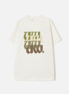 Ecru single jersey T-shirt laid flat on a light grey studio surface. Features a crew neck, short sleeves, and a chest graphic of stacked "UW." lettering in a bold blackletter-style font, transitioning from olive green at the top to dark brown at the base. A small branded woven label sits at the back neck.