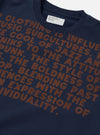 A close up detail shot of the Universal Works Navy Brushback Sweat Cool Of Jazz Loose Sweatshirt against a plain background, focusing on the texture of the navy blue brushed cotton fabric, graphic printing, and precise collar stitching.