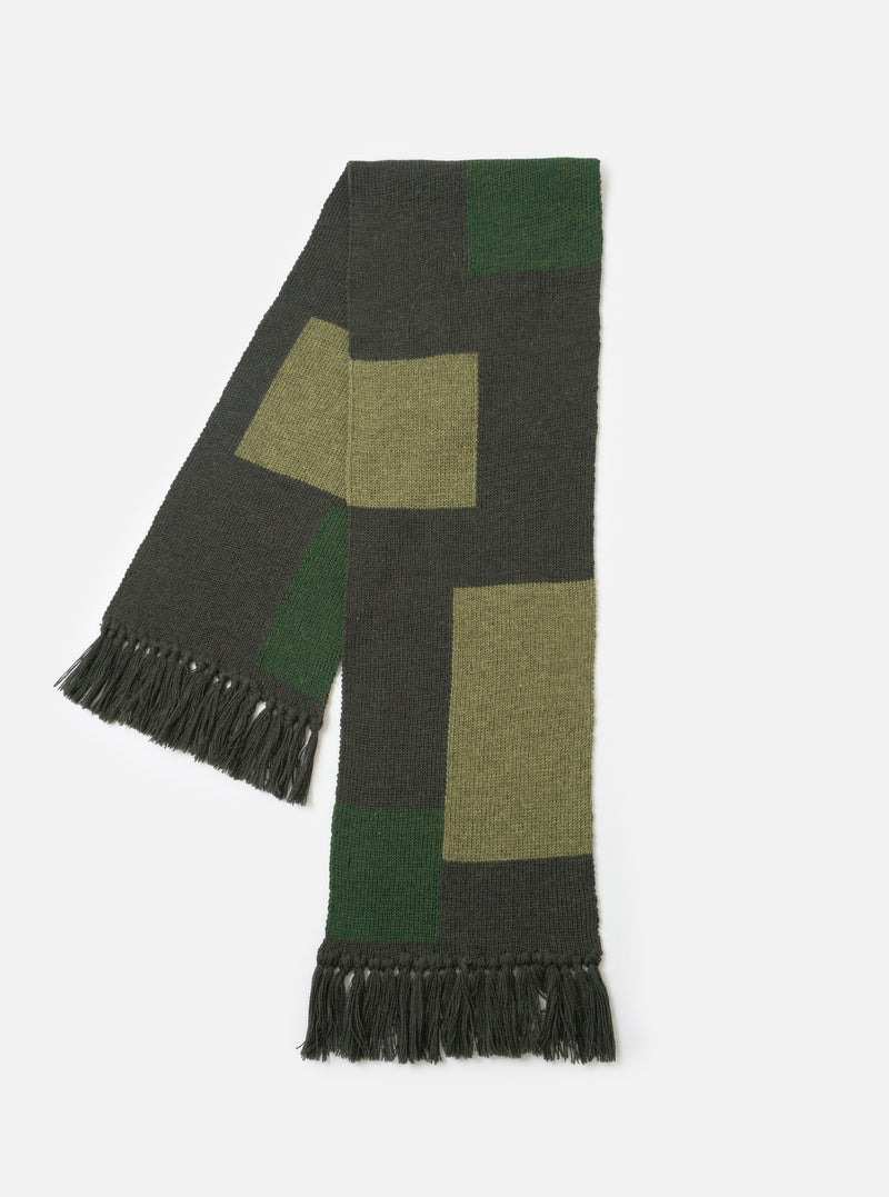 The Olive British Wool Scarf displayed flat against a plain light studio background. Made from olive green British wool, the classic rectangular scarf features subtle ribbed edging and a textured finish.