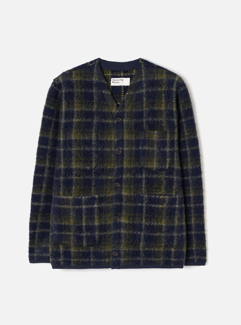 The Navy/Olive Check Daffy Fleece Mix Cardigan displayed flat against a clean studio backdrop. Features a navy and olive checked fleece pattern, buttoned front placket, side pockets, and a soft texture.