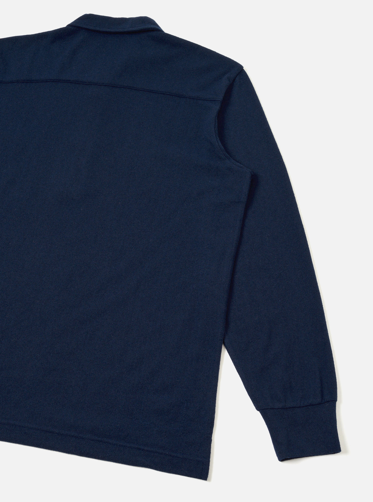 Rear view of the Dark Navy Recycled Wool Mix SJ Pullover L/S Shirt displayed on a plain background. The long-sleeve polo features a ribbed collar, button placket, chest pocket, and clean back yoke.