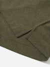 Detail view of the Olive Recycled Wool Mix SJ Pullover L/S Shirt on a plain background, showing the classic shirt collar, four-button closure, chest patch pocket, and textured olive jersey knit.