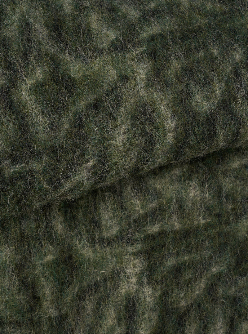 A close-up fabric swatch image of the Olive Snug Fleece Cardigan set against a plain light background, highlighting the distinct texture, soft fleecy knit structure, and subtle olive green color palette of the material.