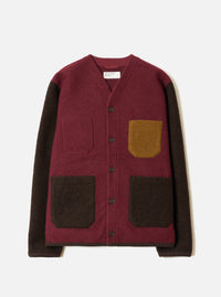 A male model wearing the Berry/Brown Wool Fleece Cardigan set against a plain light background. The full front shot highlights the curved v-neck, five-button front closure, patch pockets, and contrasting berry-brown knit fabric.