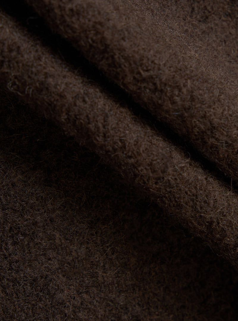 A square fabric swatch image of the Brown/Indigo Wool Fleece Cardigan on a plain background, focusing on the rich combination of brown and indigo fibers woven together into a warm wool fleece blend.