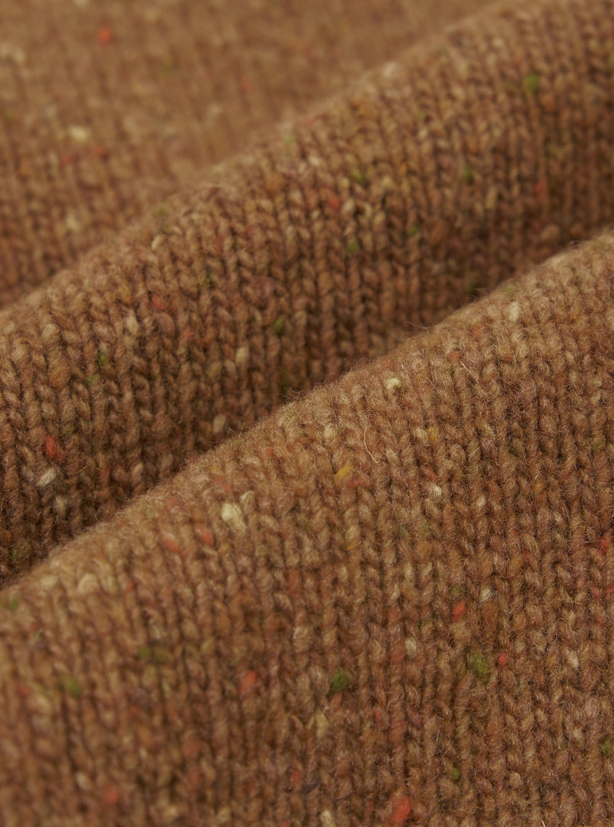 A close-up fabric swatch image of the Brown Wool Fleck Langdale Cardigan against a plain background, highlighting the flecked textured pattern, soft recycled wool material, and rich brown color tone.