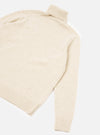 A back view of a model wearing the Fawn Wool Fleck Roll Neck on a plain background, highlighting the comfortable tailored drape, ribbed trim finishes, and natural fawn wool fleck knit fabric.
