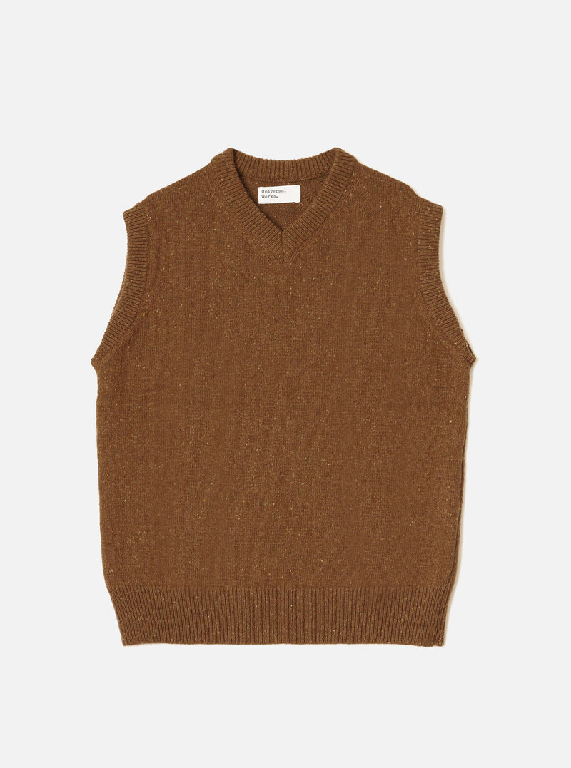 A model wearing the Brown Wool Fleck Sweater Vest against a clean studio backdrop. The sleeveless knit features a V-neck opening, ribbed edges, and a rich brown recycled wool fabric with fleck details.