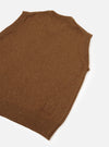 A back view of a model wearing the Brown Wool Fleck Sweater Vest on a light plain background, demonstrating the relaxed fit, classic sleeveless style, and soft flecked recycled wool construction.