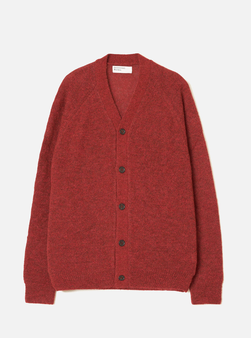 A model wearing the Deep Orange Alpaca Knit David Cardigan on a simple neutral background. The vibrant cardigan highlights a buttoned front, relaxed fit, V-neck design, and fluffy alpaca blend texture.