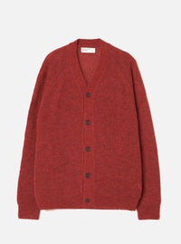 A model wearing the Deep Orange Alpaca Knit David Cardigan on a simple neutral background. The vibrant cardigan highlights a buttoned front, relaxed fit, V-neck design, and fluffy alpaca blend texture.