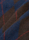 A close-up fabric swatch view of the Navy Alpaca Argyle David Cardigan set against a plain backdrop, highlighting the soft knit texture, argyle pattern detail, and rich alpaca wool blend construction.